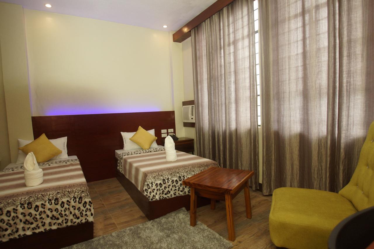 Hacasi Hotel Anibong Bagian luar foto