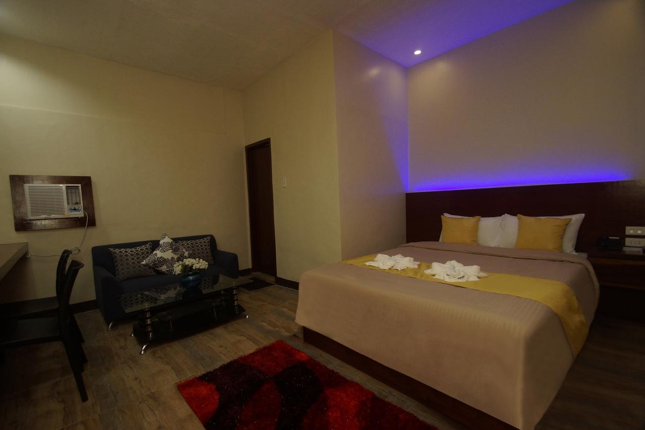 Hacasi Hotel Anibong Bagian luar foto